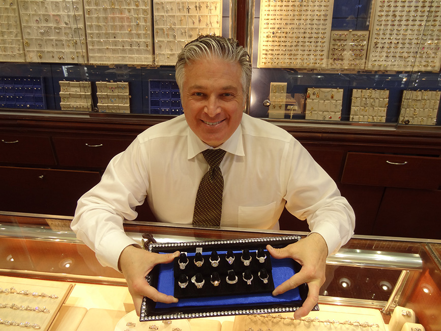 Michael E. Minden Showing Wedding Rings In His Store