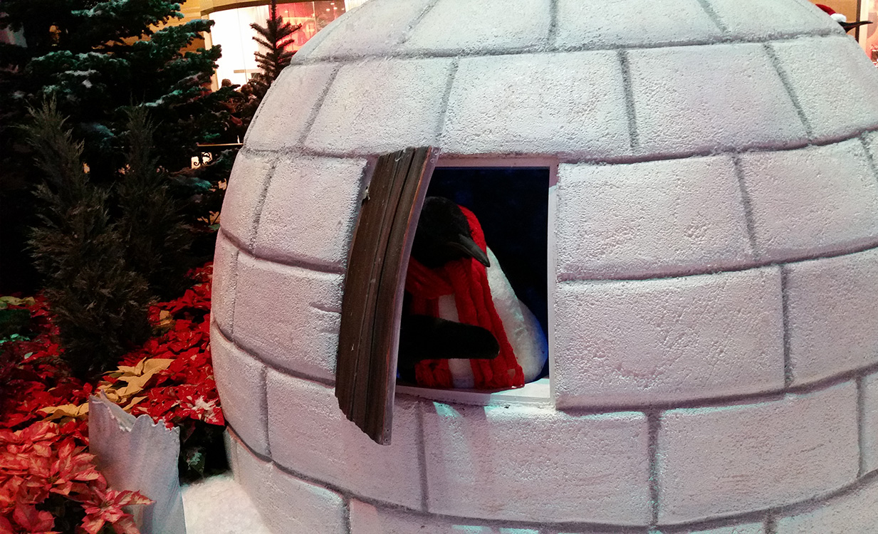 Penguin-Peeking-Out-of-Igloo,-Bellagio-Conservatory-Christmas-Theme,-Las-Vegas-2014