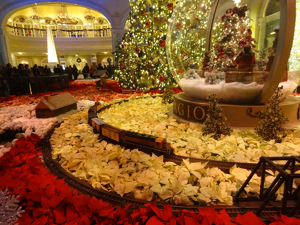 Train-coming-around-the-tracks,-Bellagio-Conservatory-Christmas-Celebration,-2014-Las-Vegas