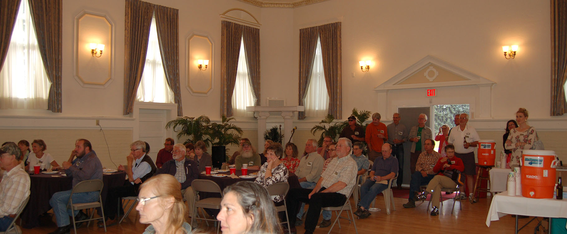 Crowd shot of Vital Ground's 25th anniversary celebration at Heritage Hall, Fort Missoula